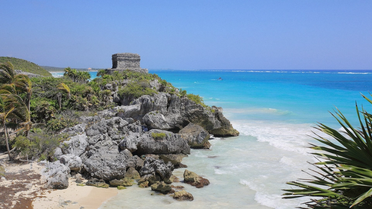 Mayan temple of the winds on the cliff above the Caribbean at Tulum, Mexico